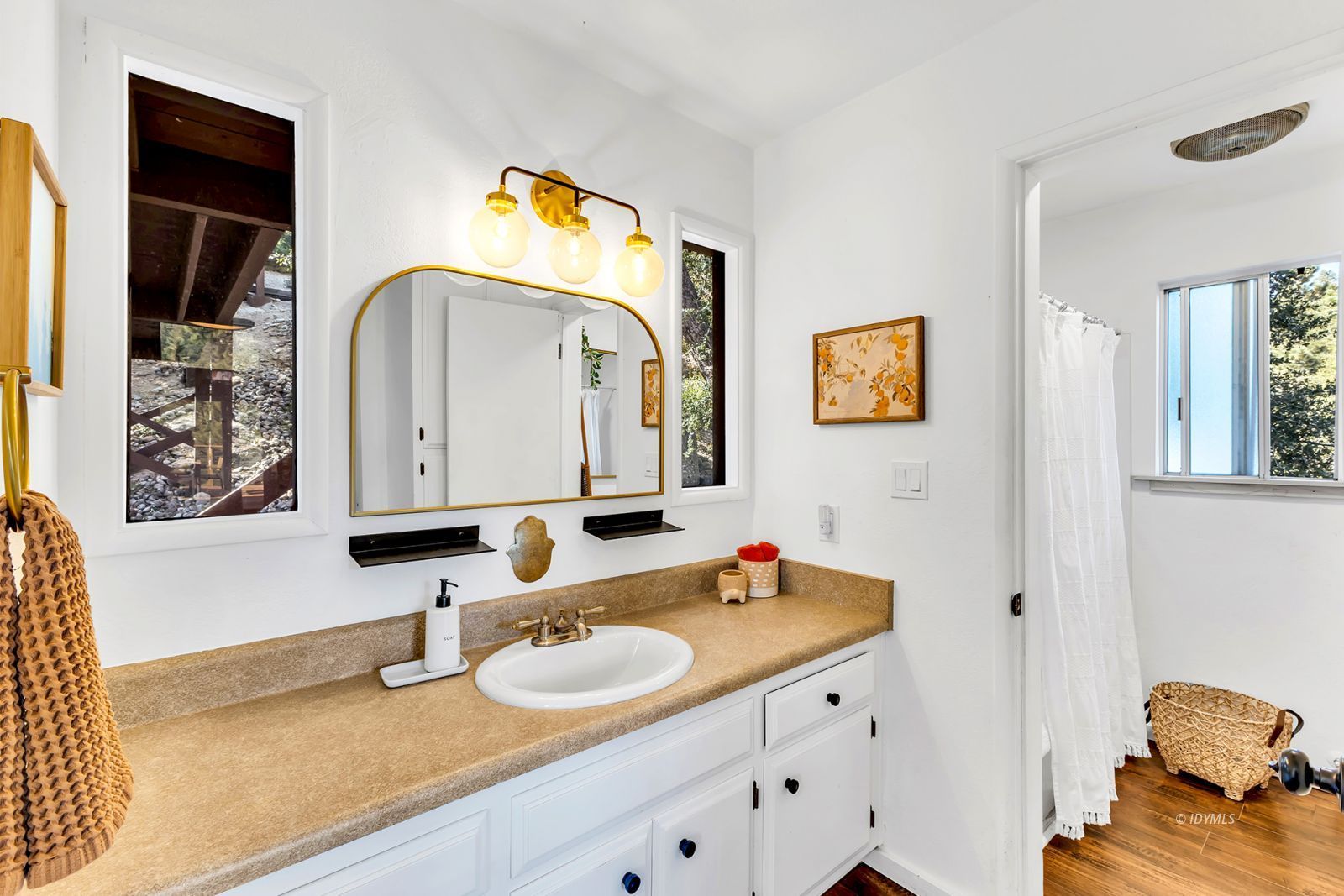 26870 Robin Drive Idyllwild, CA 92549 - Photo 37 of 68 a bathroom with a sink and a mirror
