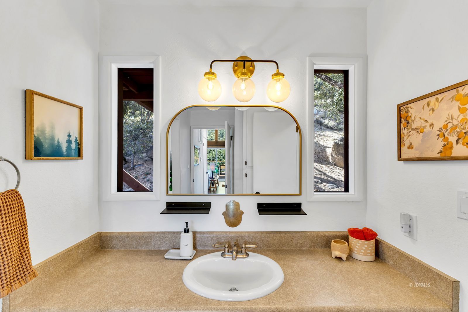 26870 Robin Drive Idyllwild, CA 92549 - Photo 38 of 68 a bathroom with a sink mirror and vanity