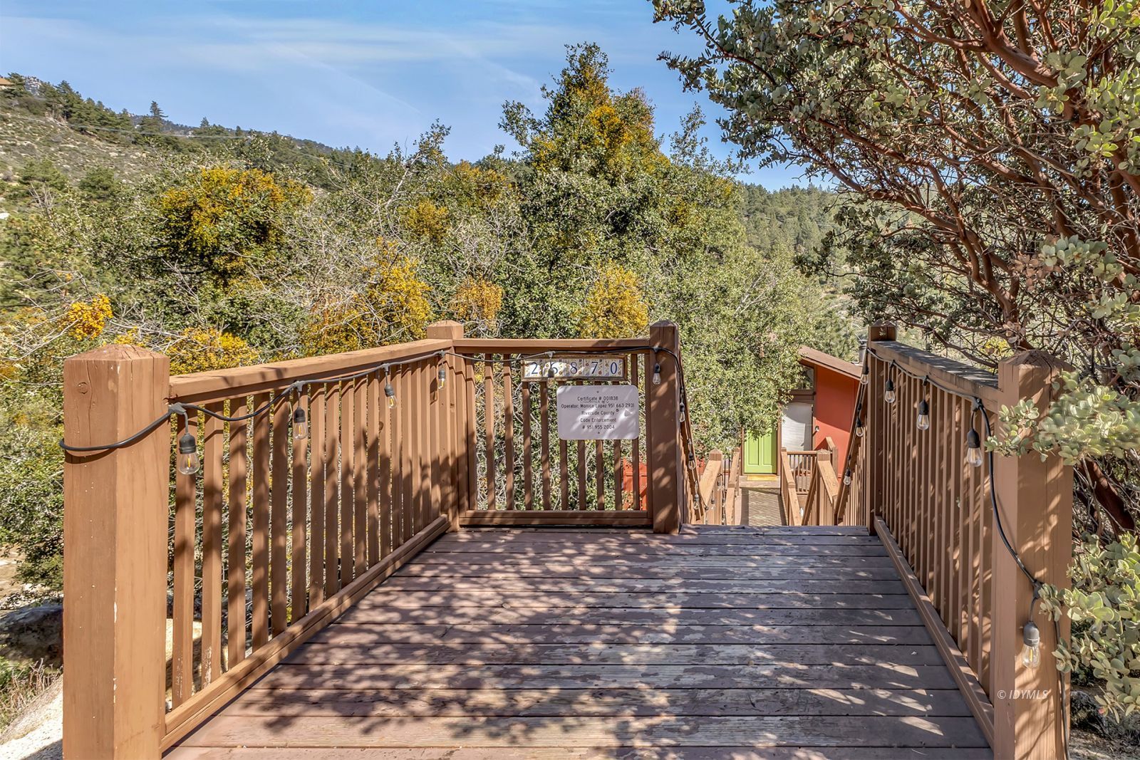 26870 Robin Drive Idyllwild, CA 92549 - Photo 4 of 68 a view of balcony with wooden floor and fence