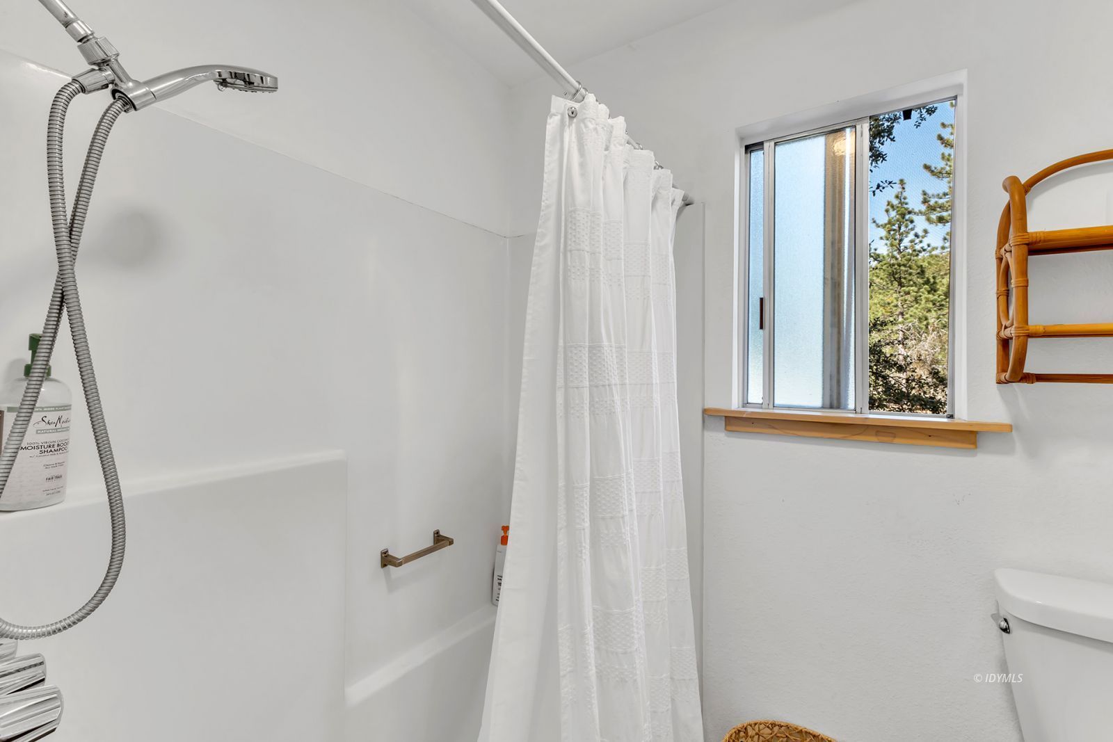 26870 Robin Drive Idyllwild, CA 92549 - Photo 42 of 68 a bathroom with a shower curtain and a window
