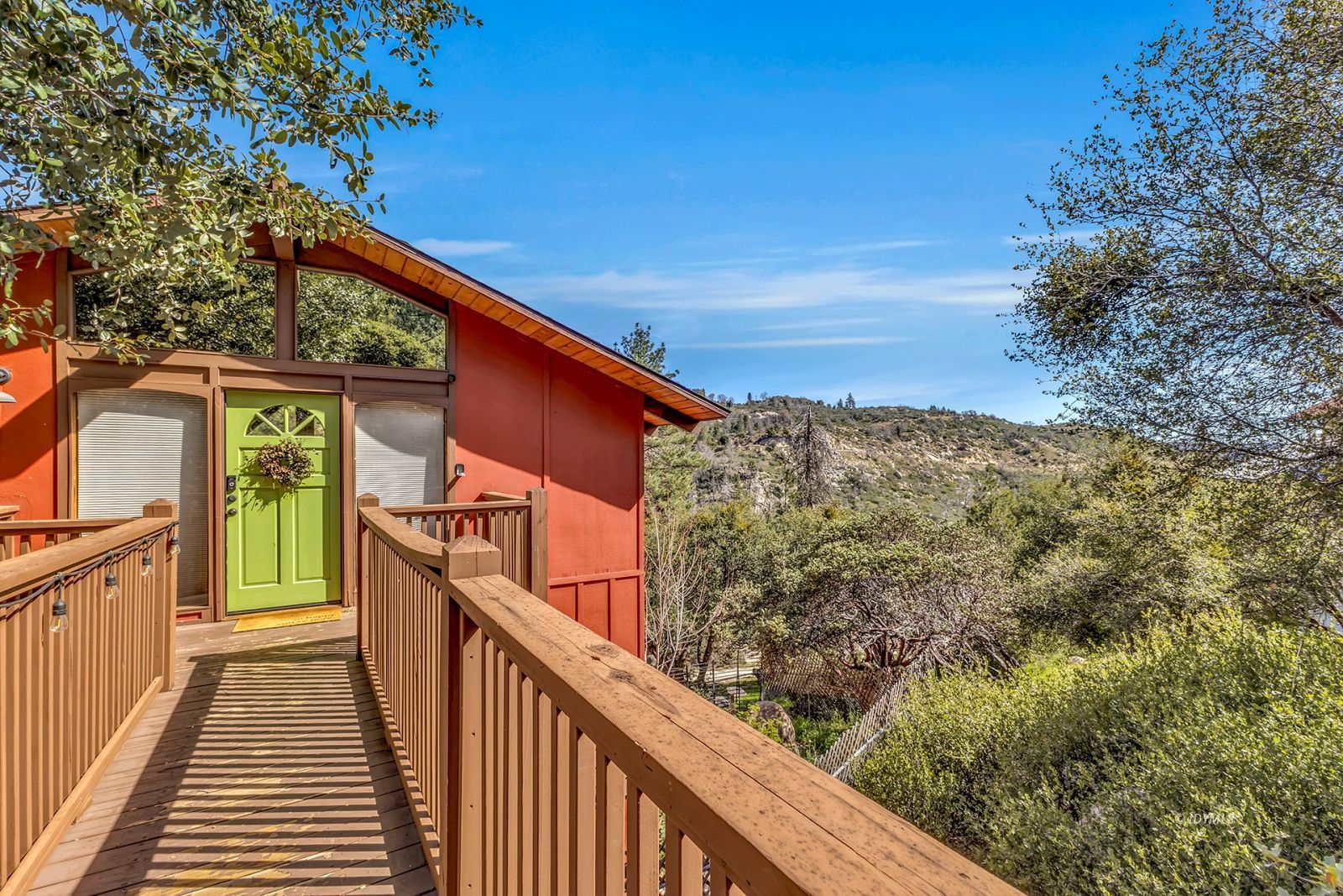 26870 Robin Drive Idyllwild, CA 92549 - Photo 5 of 68 a view of a balcony with wooden fence and floor