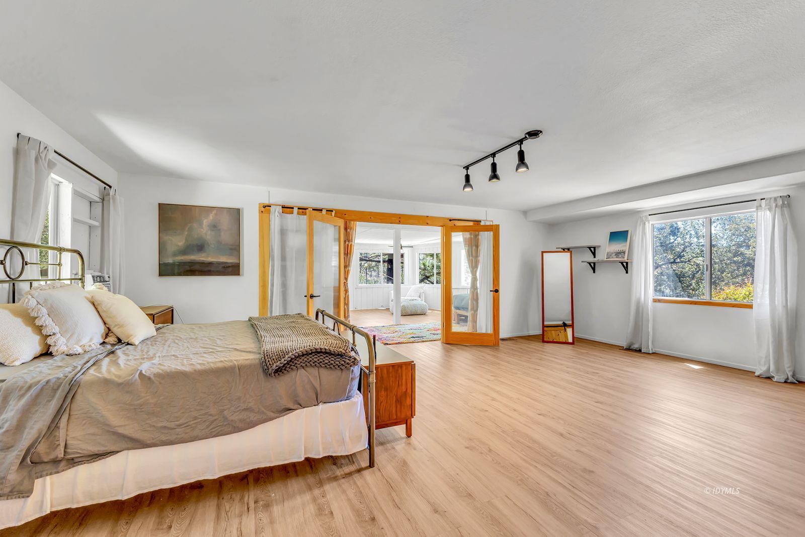 26870 Robin Drive Idyllwild, CA 92549 - Photo 52 of 68 a spacious bedroom with a large bed and a large window