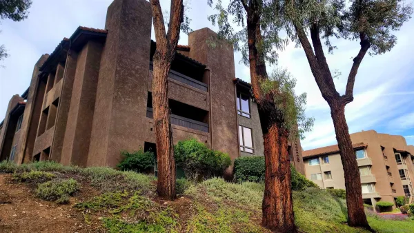a view of a house with a tree