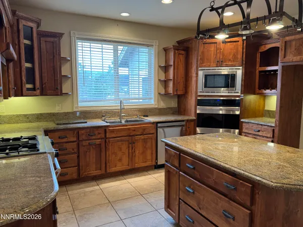 a kitchen with a stove and a sink