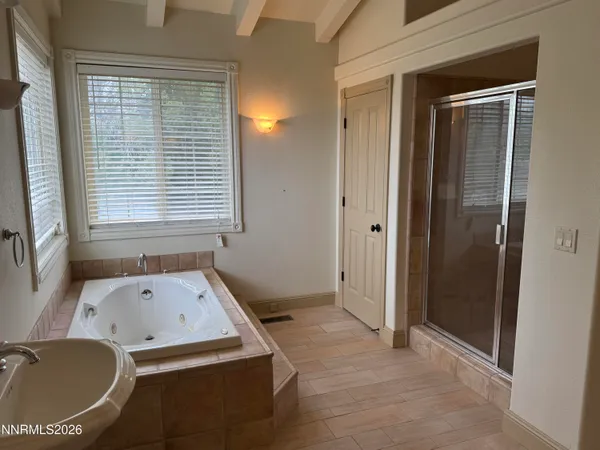 a bathroom with a tub and a sink