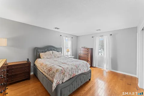 a bedroom with a bed and a closet
