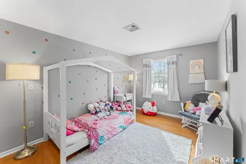 a bedroom with baby toys and a couch