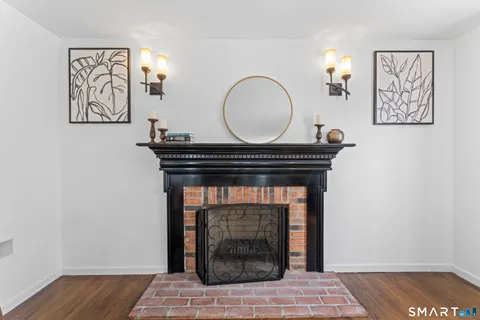 a view of fireplace and wooden floor
