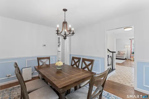 a view of a dining room furniture and chandelier