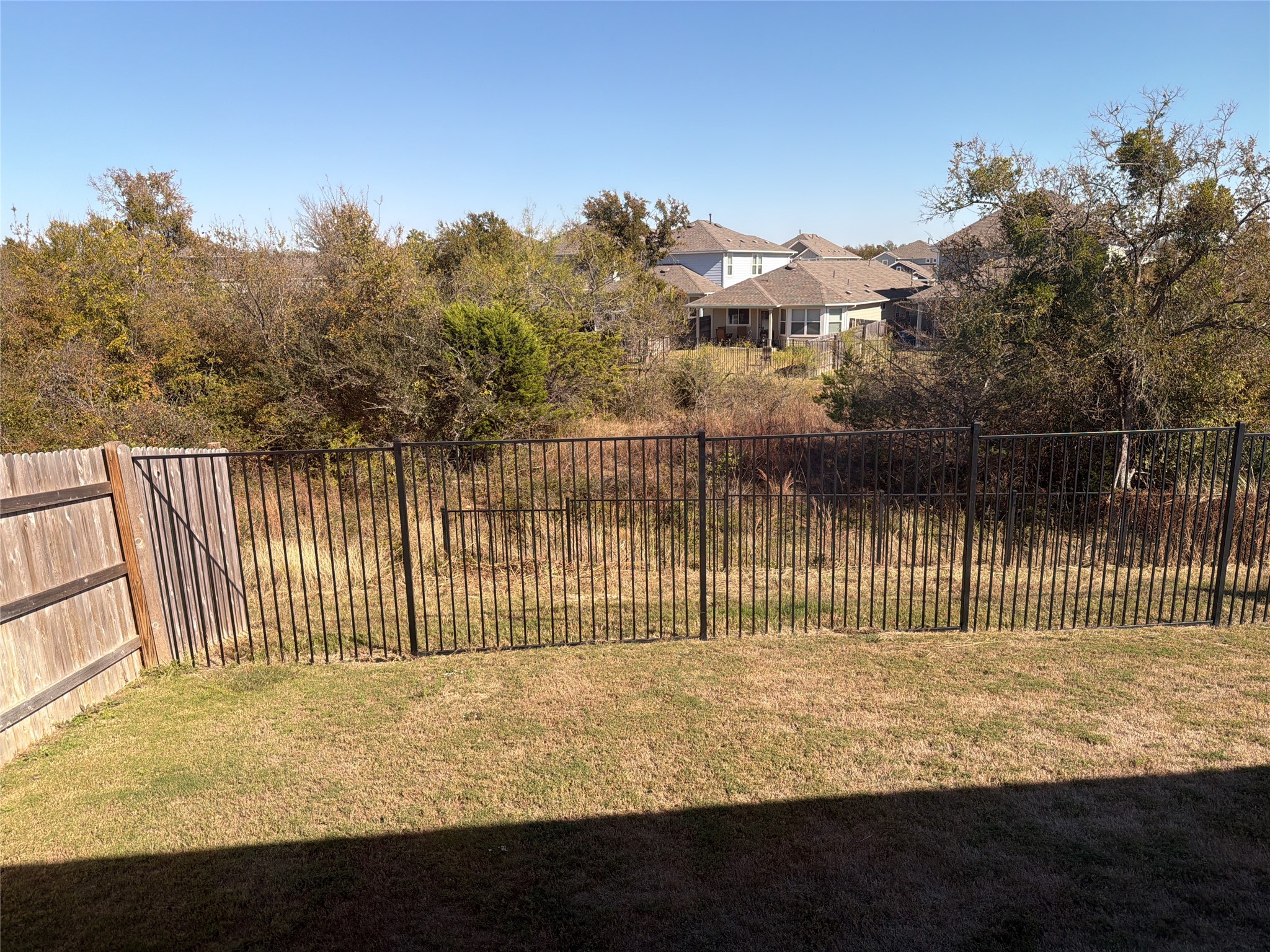 129 Tall Grass Drive Georgetown, TX 78628 - Photo 18 of 21 a view of a house with a fence