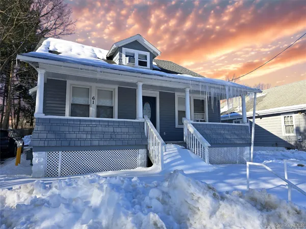 a kitchen with white cabinets stainless steel appliances and sink