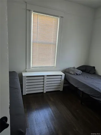 a view of a room with furniture and a window