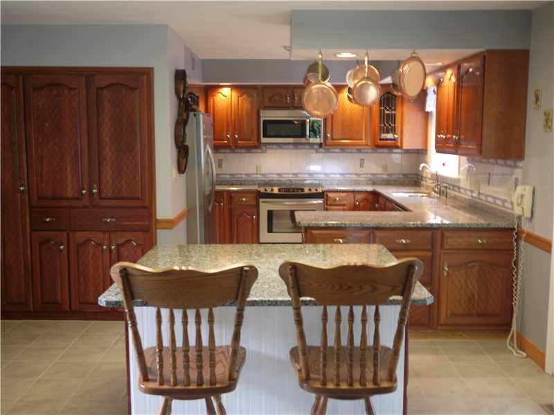 552 Blackhawk Road Beaver Falls, PA 15010 - Photo 3 of 24 Kitchen. A Cooks "Dream" New granite counters and Island Cherry Cabinets with stunning detail and lovely hardware, Huge Pantry with pull out shelves in island