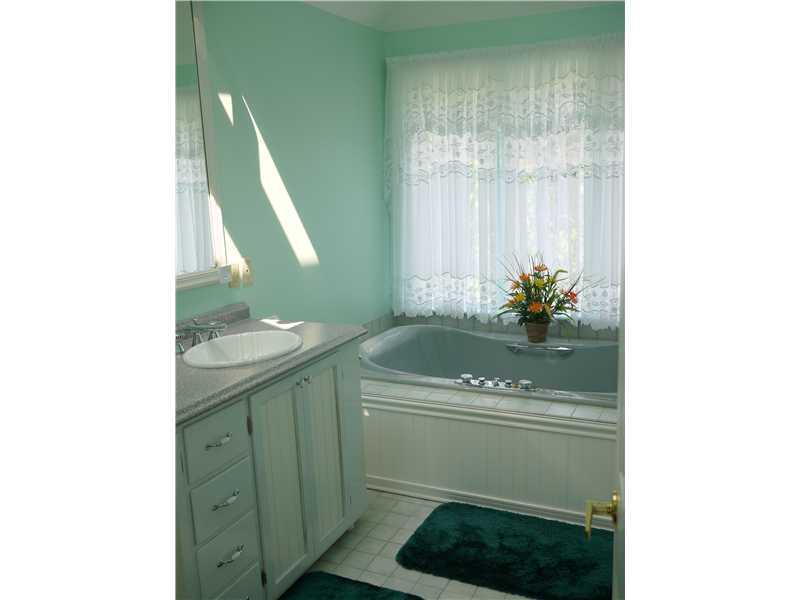 552 Blackhawk Road Beaver Falls, PA 15010 - Photo 9 of 24 Master Bath/Spa. Ahhh..Relax in the Elegant Spa tub that has a view of the pool and rear grounds of the property. This suite has a shower and walk in closet as well. New Sinks!