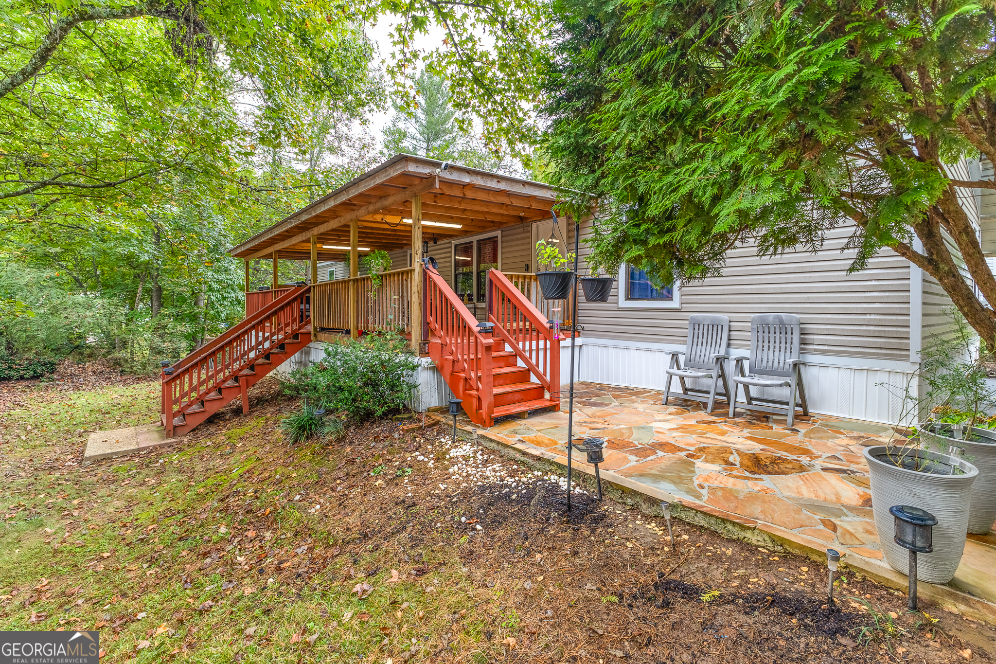 a house view with a backyard space