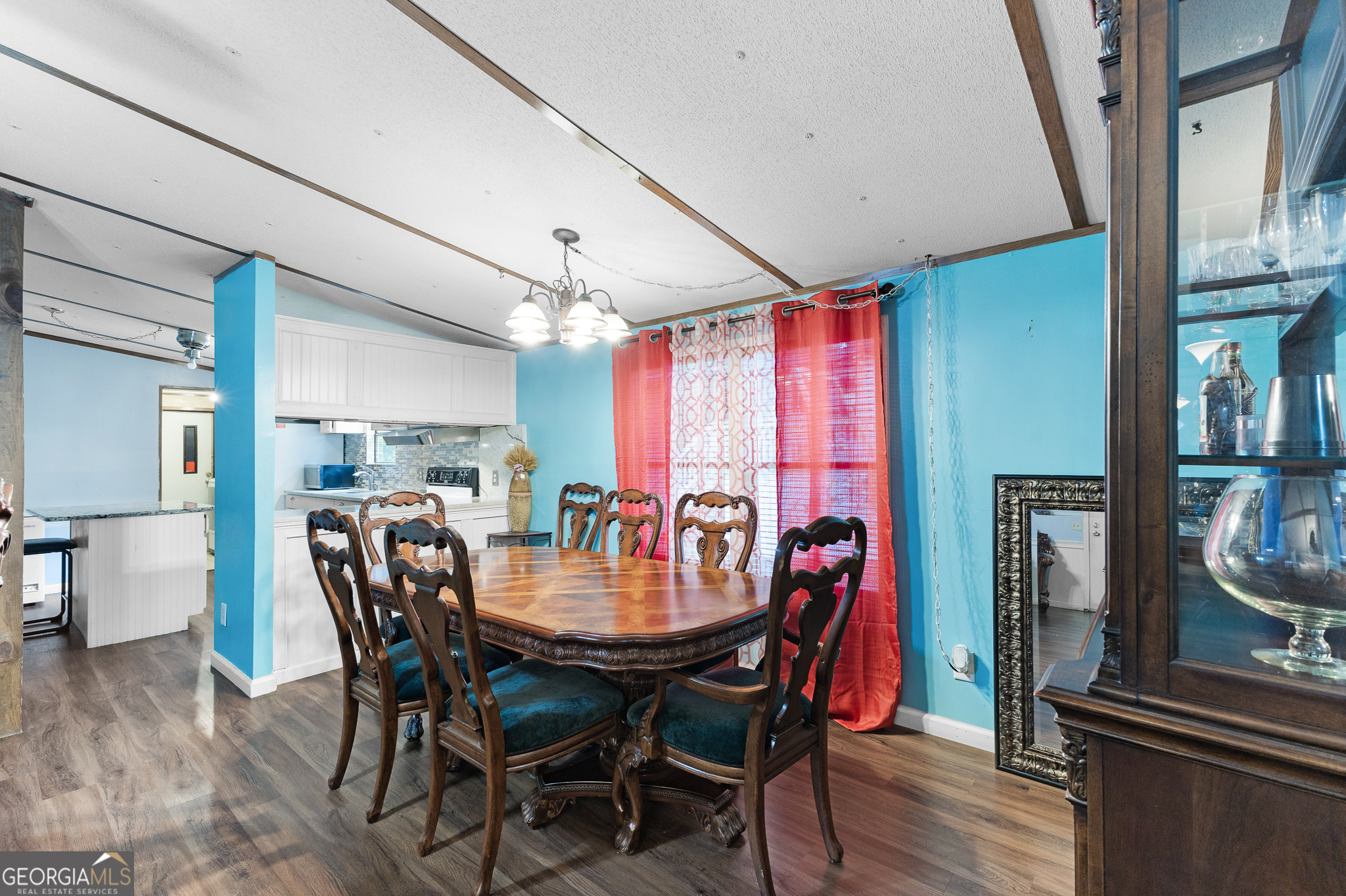 5758 Hickory Wood Lane, Unit 336 Buford, GA 30518 - Photo 12 of 28 a view of a dining room with furniture and wooden floor