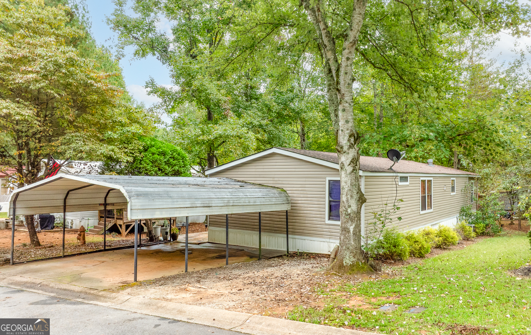 5758 Hickory Wood Lane, Unit 336 Buford, GA 30518 - Photo 3 of 28 a house view with a outdoor space