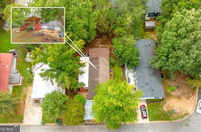 an aerial view of a residential houses with outdoor space