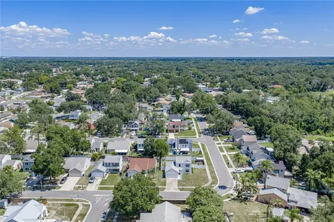 an aerial view of residential houses with outdoor space and street view