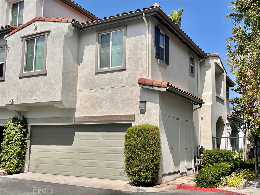 12 Jaynes Place Buena Park, CA 90621 - Photo 10 of 12 a front view of a house with garage
