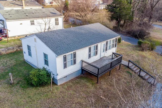 a aerial view of a house with a yard and plants
