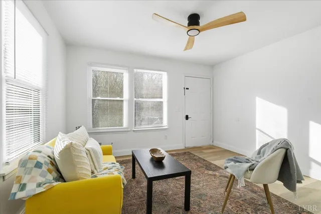 a living room with furniture and a window