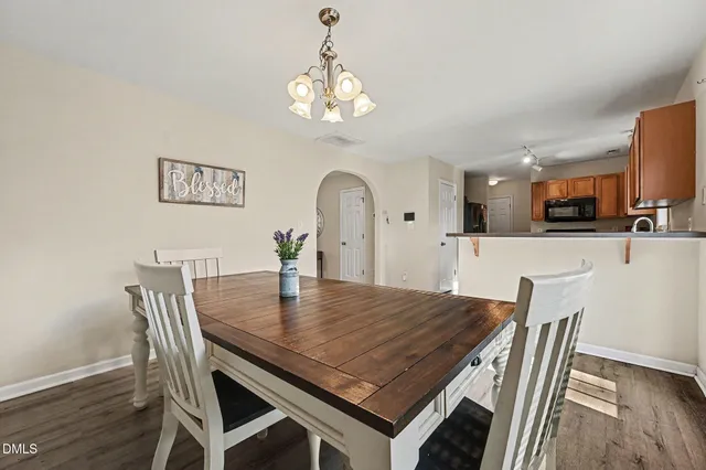 a kitchen with stainless steel appliances granite countertop a sink stove and microwave