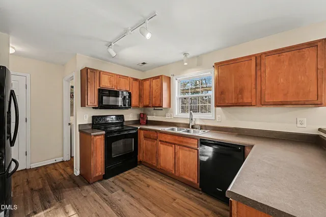 a view of a storage & utility room with wooden floor