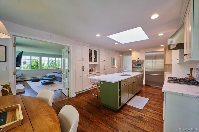 a kitchen with stainless steel appliances granite countertop a stove and a refrigerator