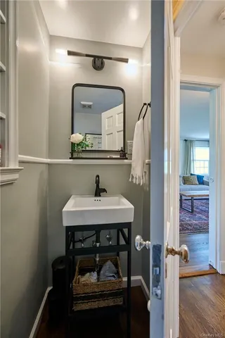 a bathroom with a sink a mirror a vanity and window