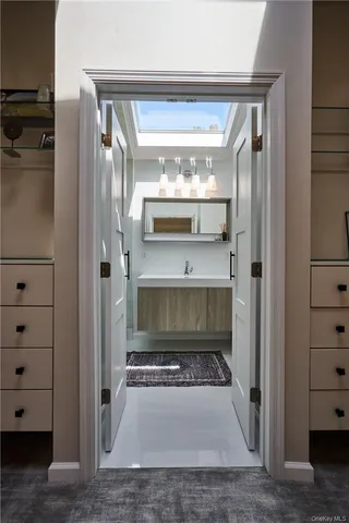 a bathroom with a glass shower door