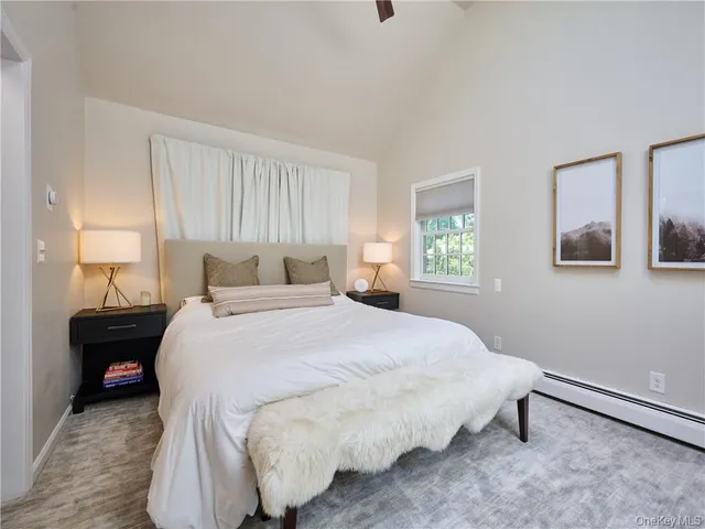 a bedroom with a bed and window