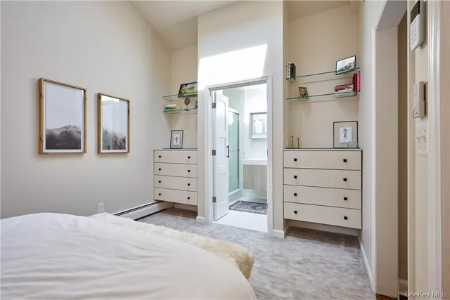 a bed room with a bed and a television