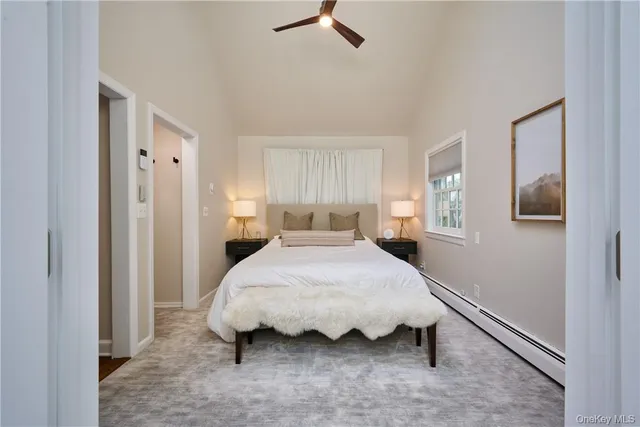 a bedroom with a bed and window