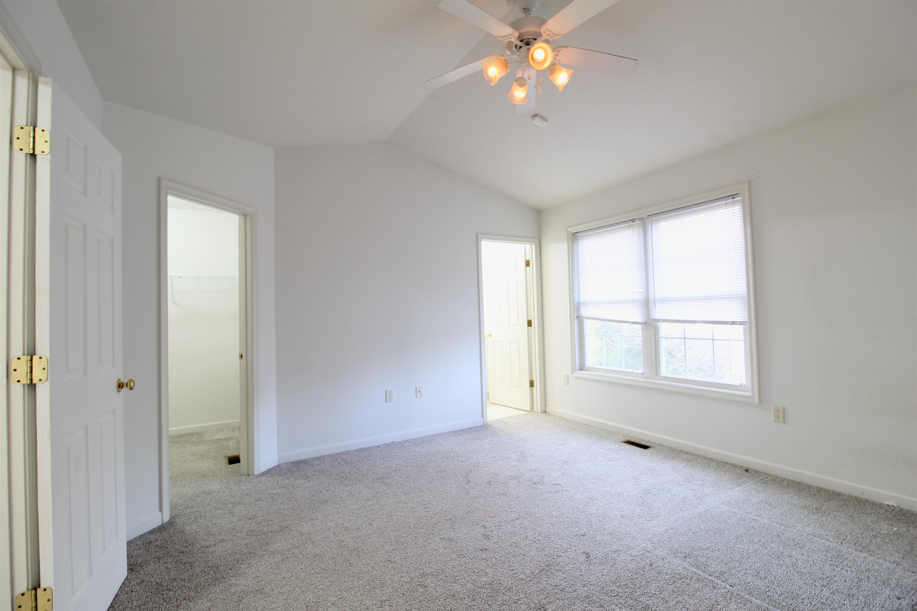 2911 Diamond Spring Lane Harrisonburg, VA 22801 - Photo 11 of 23 an empty room with windows and chandelier fan