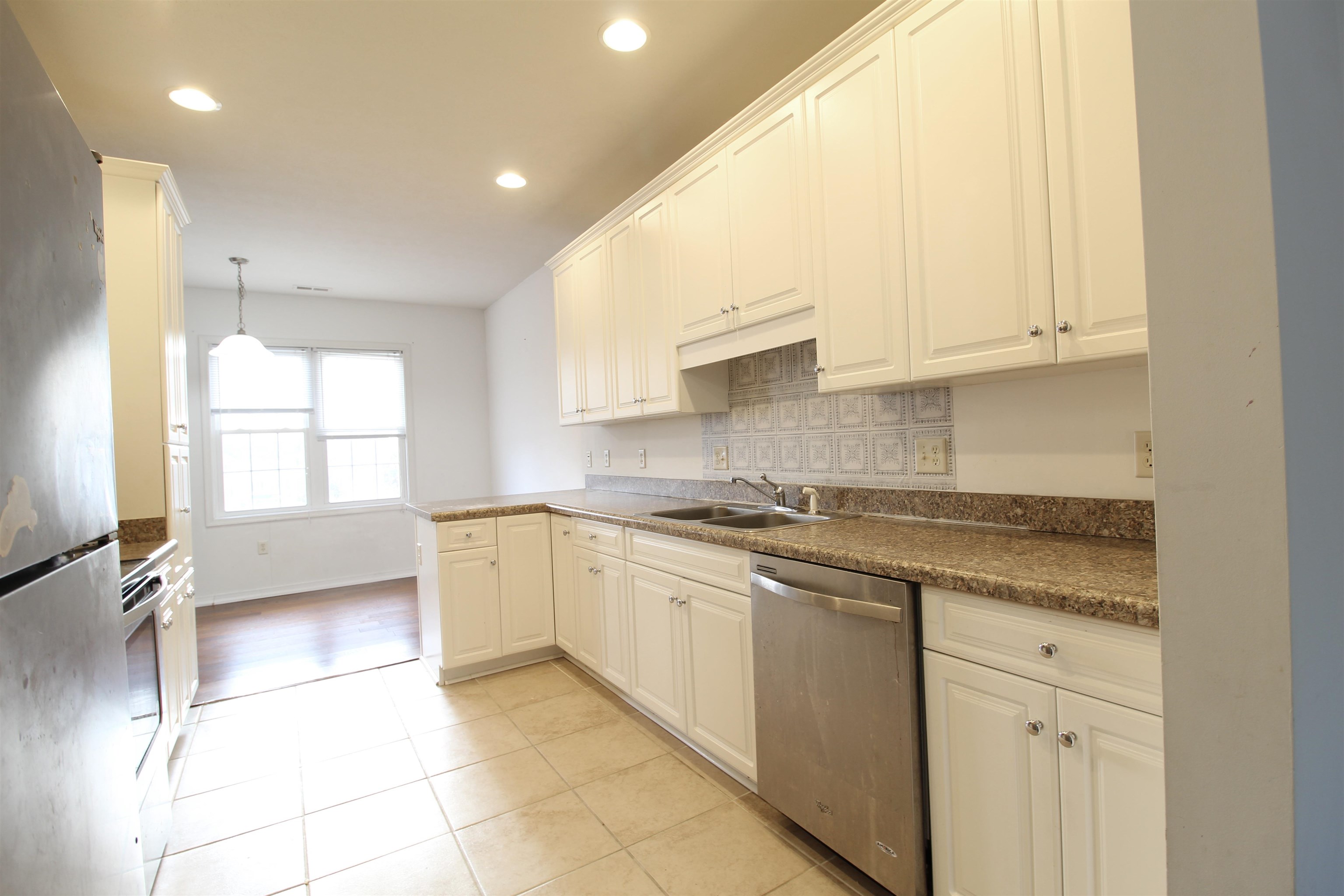 2911 Diamond Spring Lane Harrisonburg, VA 22801 - Photo 2 of 23 a kitchen with a stove a sink and a refrigerator