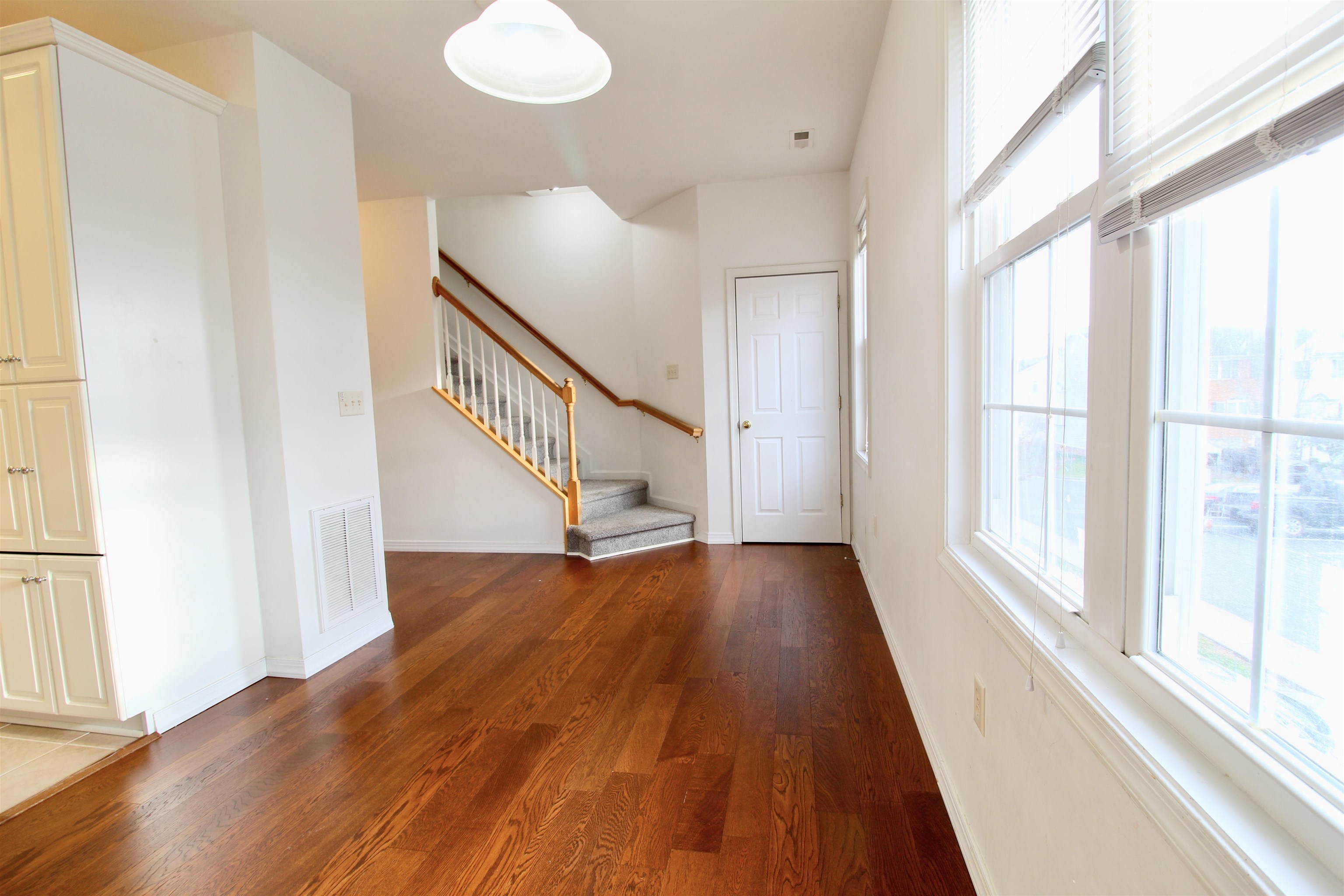 2911 Diamond Spring Lane Harrisonburg, VA 22801 - Photo 7 of 23 a view of a hallway with wooden floor and staircase