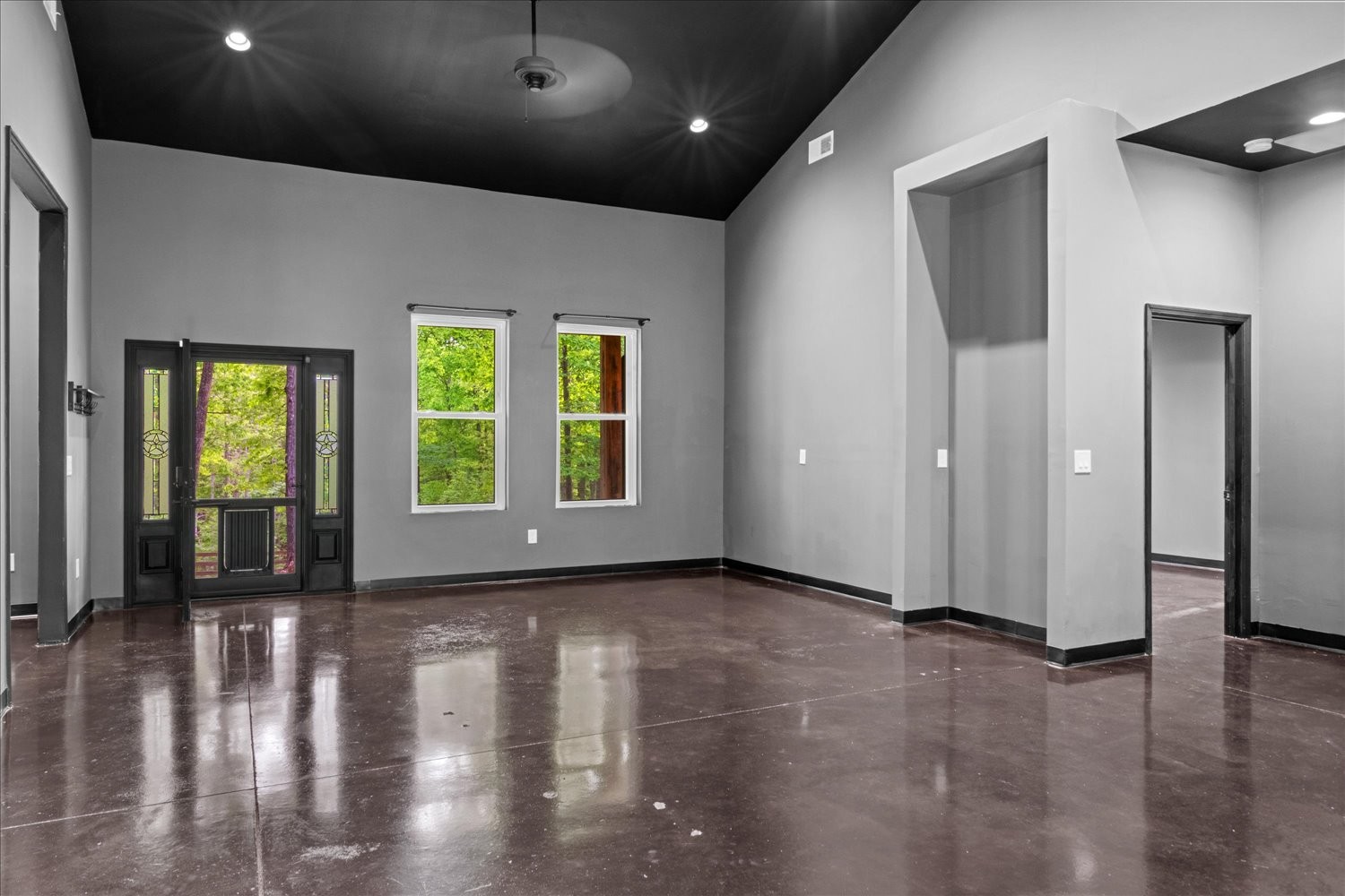 8360 Pinewood Road Lyles, TN 37098 - Photo 11 of 49 an empty room with wooden floor and windows