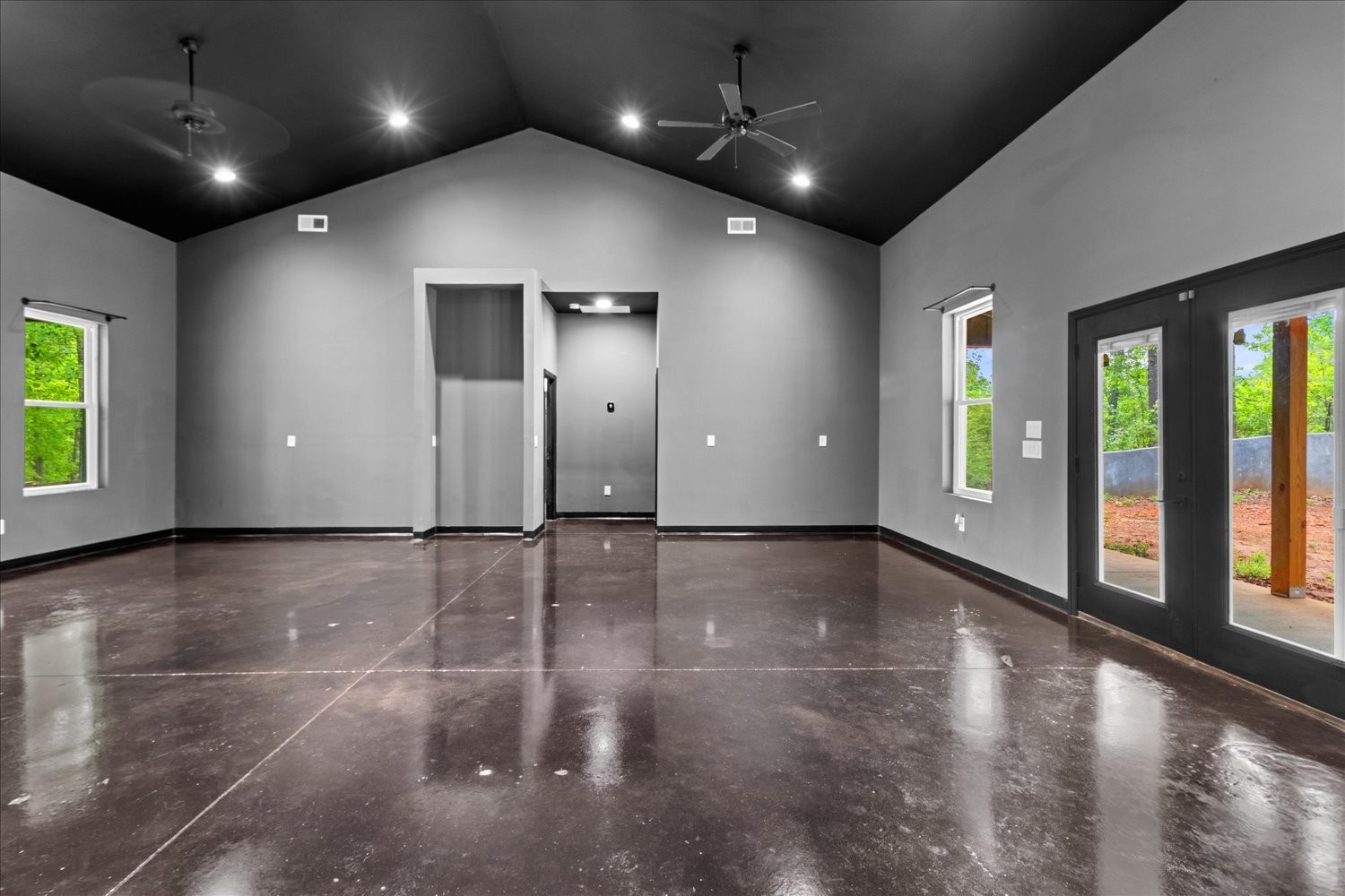 8360 Pinewood Road Lyles, TN 37098 - Photo 12 of 49 an empty room with windows and ceiling fan