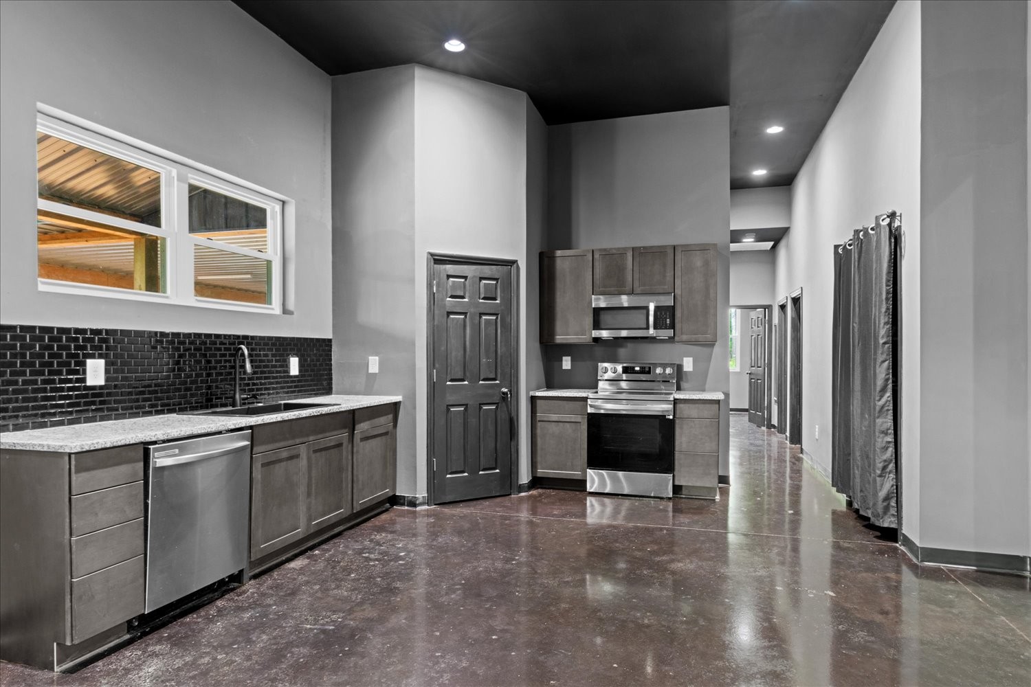 8360 Pinewood Road Lyles, TN 37098 - Photo 14 of 49 a kitchen with stainless steel appliances a refrigerator sink and stove