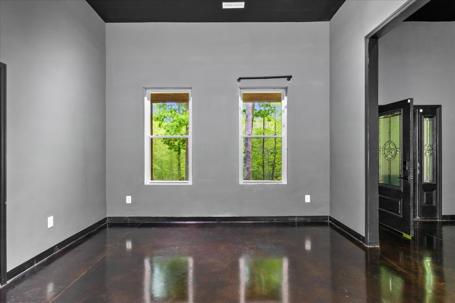8360 Pinewood Road Lyles, TN 37098 - Photo 16 of 49 a view of an empty room with wooden floor and a window
