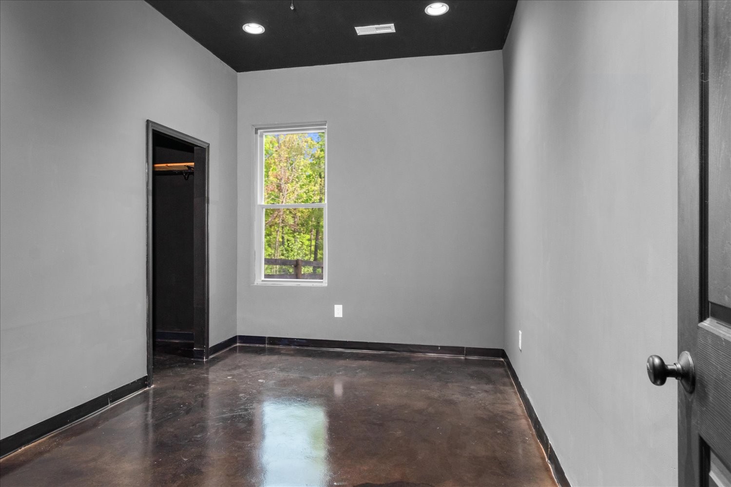 8360 Pinewood Road Lyles, TN 37098 - Photo 26 of 49 an empty room with wooden floor and windows