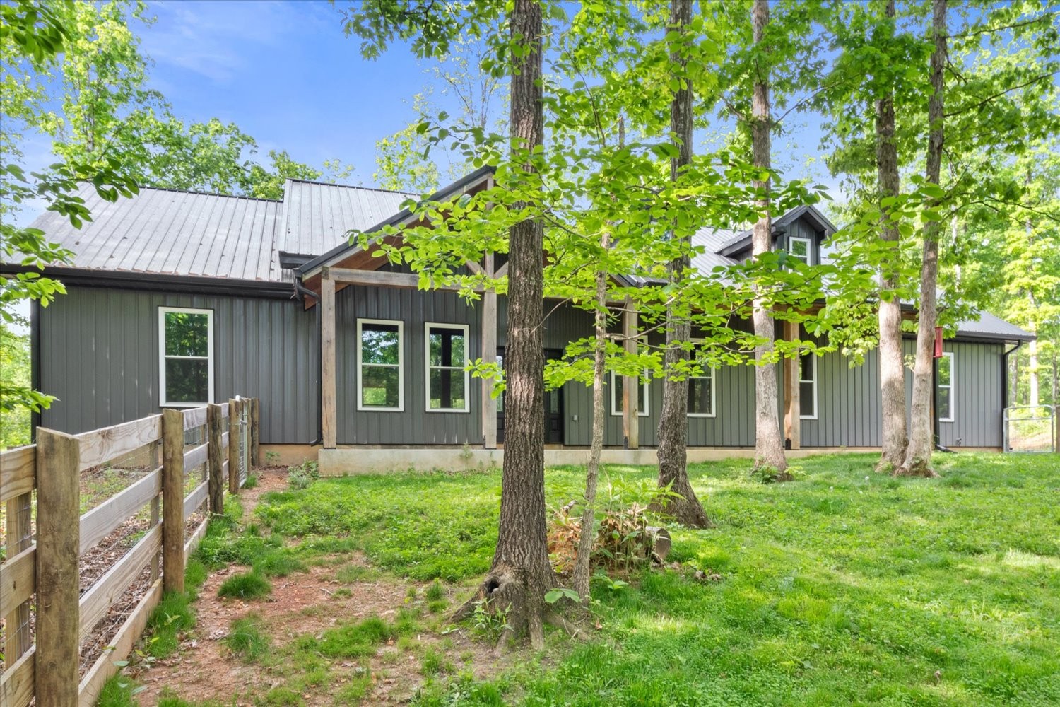 8360 Pinewood Road Lyles, TN 37098 - Photo 3 of 49 a front view of a house with garden