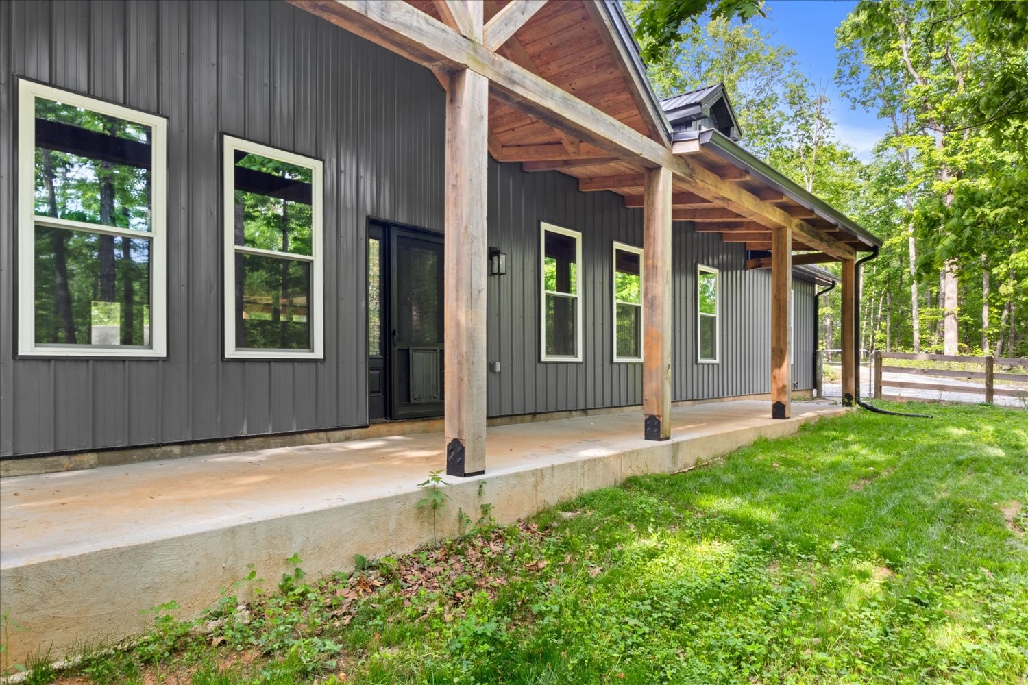 8360 Pinewood Road Lyles, TN 37098 - Photo 4 of 49 a front view of a house with a yard