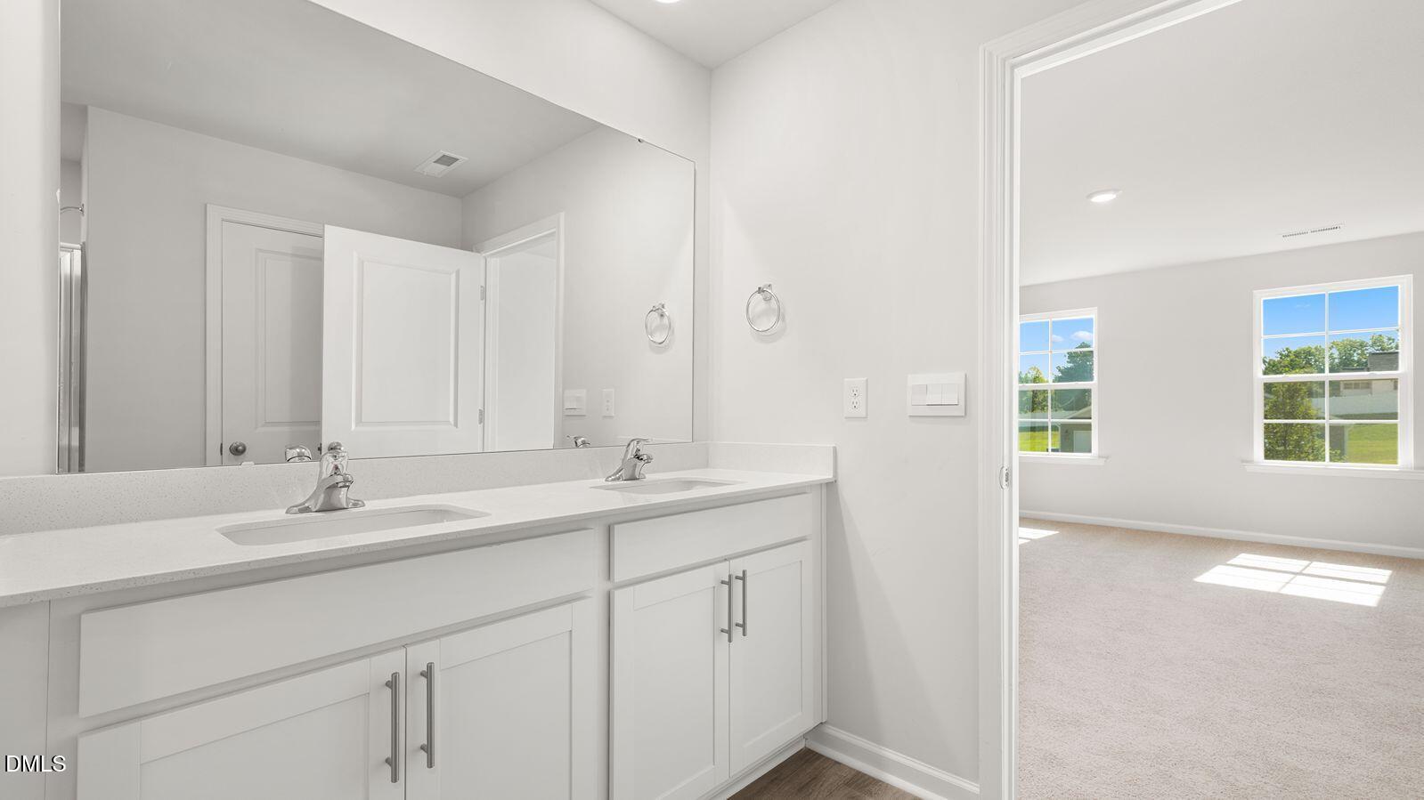 133 Daniel Road Wilson's Mills, NC 27577 - Photo 19 of 26 a bathroom with 2 sink tub and a mirror