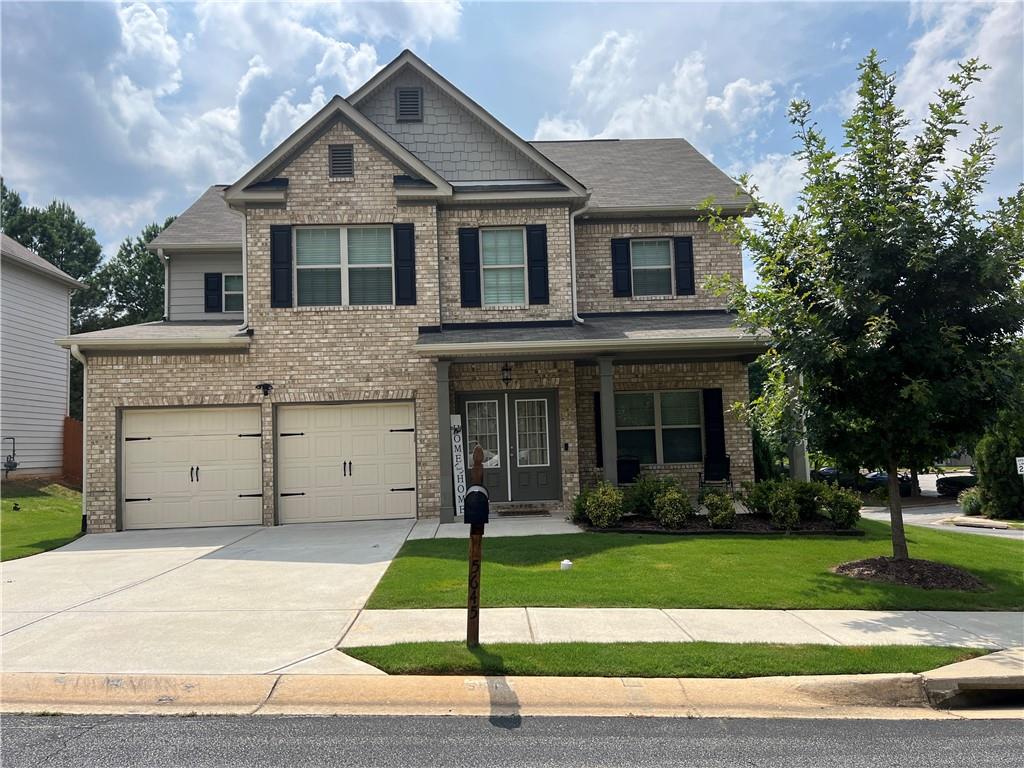 5645 Savannah River Road Atlanta, GA 30349 - Photo 1 of 1 a front view of a house with a yard
