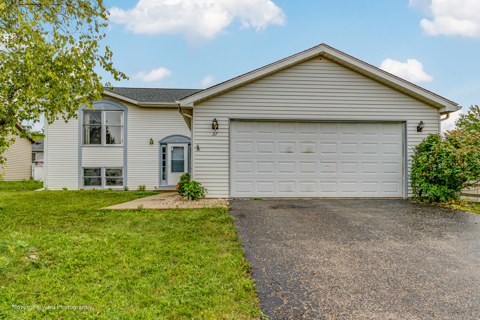 37 Evergreen Road Streamwood, IL 60107 - Photo 1 of 36 a front view of house with yard