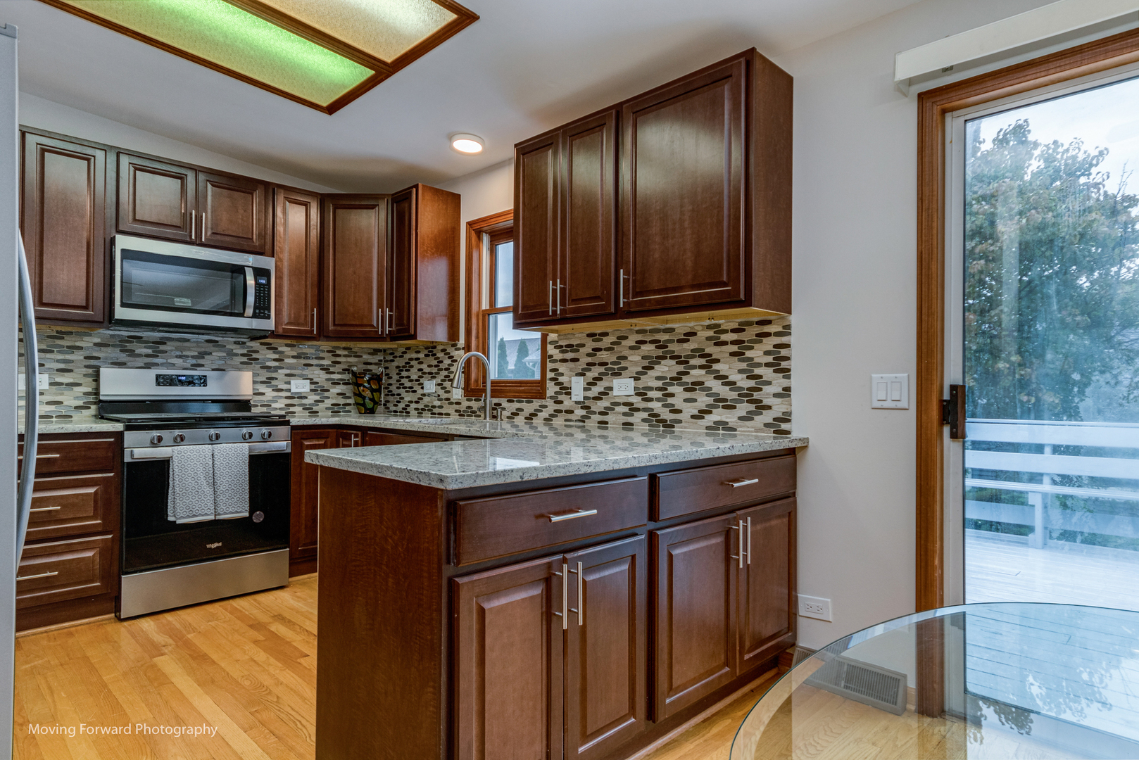 37 Evergreen Road Streamwood, IL 60107 - Photo 11 of 36 a kitchen with stainless steel appliances granite countertop wooden cabinets a stove top oven a sink and dishwasher