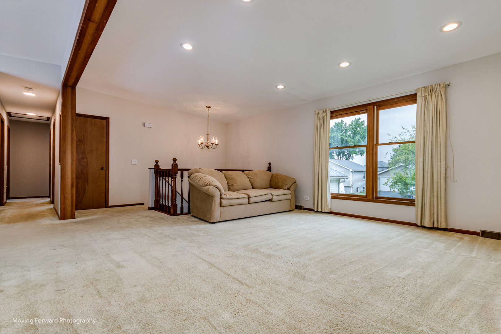 37 Evergreen Road Streamwood, IL 60107 - Photo 5 of 36 a big room with large windows and a chandelier
