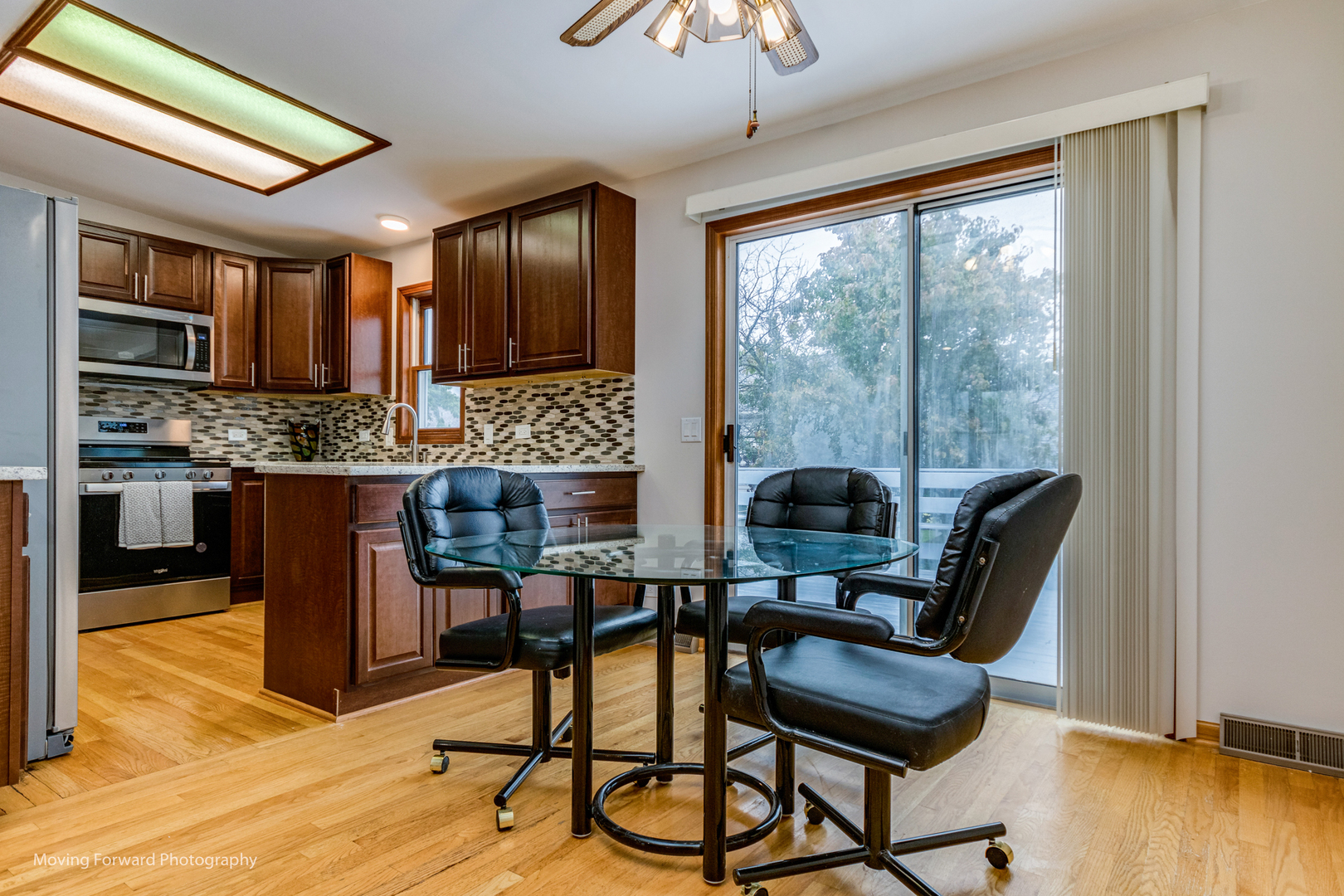 37 Evergreen Road Streamwood, IL 60107 - Photo 9 of 36 a view of a dining room with furniture window and wooden floor